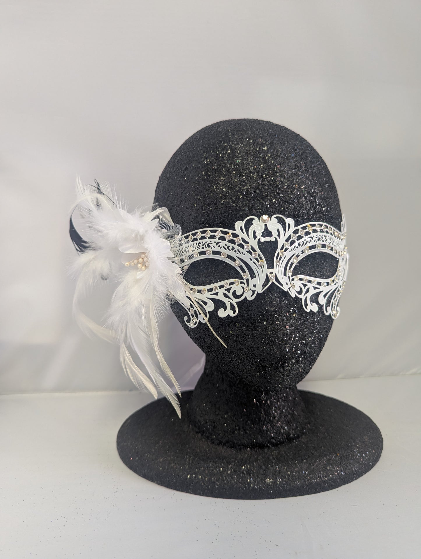 White metal mask with gems and black & white feathers